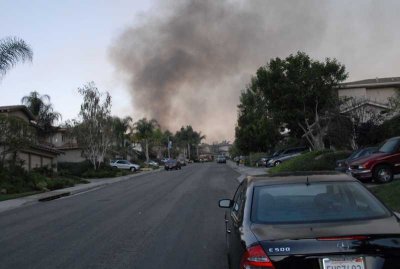 Tuesday 6:30AM fire behind houses up the block