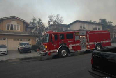 Tuesday 7:00AM fire behind houses up the block