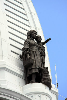 Bronze sculptures on top of City Hall tower..