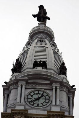 Bronze sculptures on top of City Hall tower..