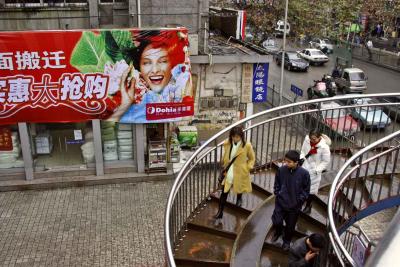One of two main walkways over the main street in  Jishou City, Hunan Province, China.