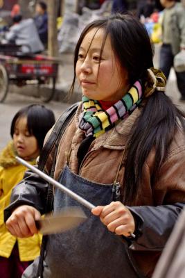 Butcher in outdoor market. Jishou City China. .jpg