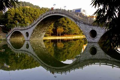 Bridge over lake at Jishou University Jishou China.