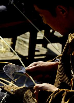 Splitting bamboo for basket making. Dehang Village, Hunan Province, China