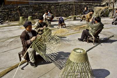 Basket making. People working in groups is a common sight.