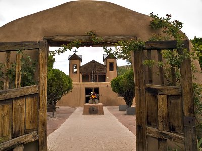 Santuario De Chimayo Mission through the entrance gate to the courtyard.