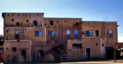 A clever painting of an indian adobe dwelling on a building facade in Cortez, CO.