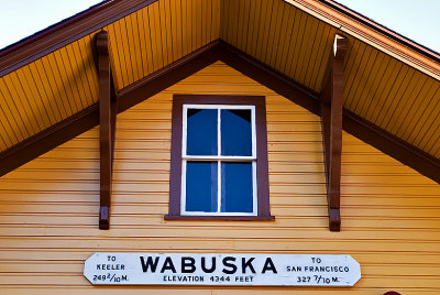 An end shot of the station showing the sign and construction detail