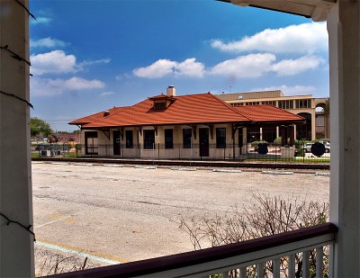 The depot framed  by  a turn of the century bandstand