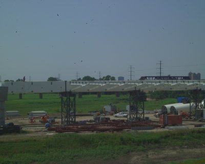 All of these Grey Towers are just for the consctruction and will be removed to allow the bridge to be suspended by the  Arch