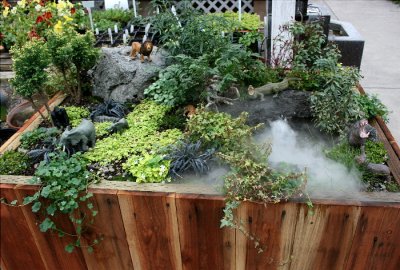  A wonderful miniature garden with a fog water feature and wild animals
