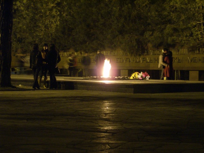 War Memorial in Panfilov Park at night. Eternal flame a good place for teenagers to keep warm