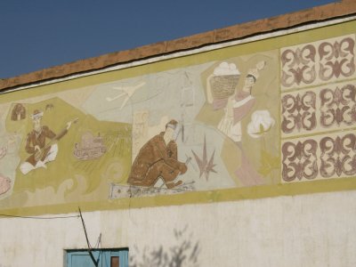 Soviet era mural behind new house