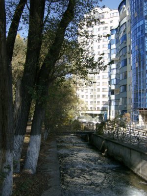 Little Almatinka River running by new blocks of flats