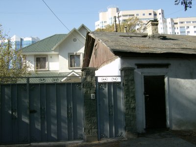 Three generations of housing - old building in front still used.