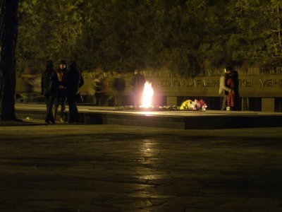 War Memorial in Panfilov Park at night. Eternal flame a good place for teenagers to keep warm