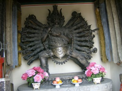 Buddhist image from little temple in front of the White Dagoba