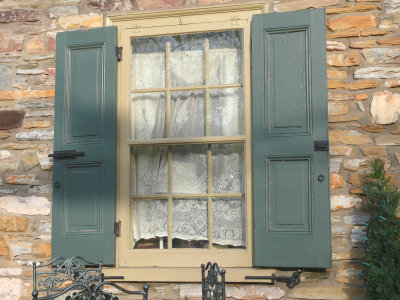 green shuttered window