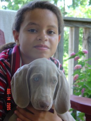 This is our granddaughter with Gracie when she was a pup