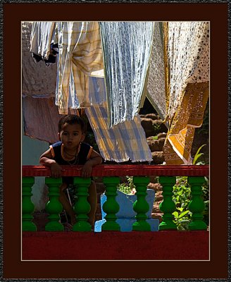 60-Boy-in-front-of-laundrydrying.jpg