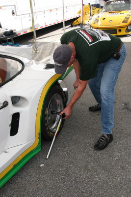 Bernie Buschen torques the center-lock wheels prior to a race