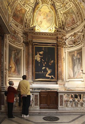 Caravaggio-  Madonna dei Pellegrini with admiring tourists- St. Agostinio, Rome.jpg