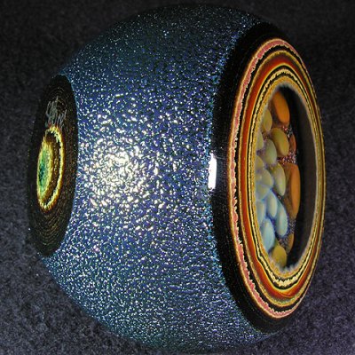 A flat bottom is carved for perfect viewing of this geode paperweight..