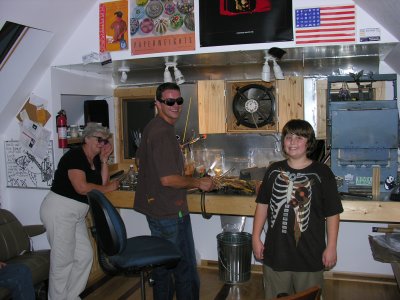 Paul Stephan in his upper garage studio with Brendon and Mom