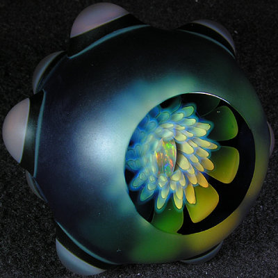 This one has it all - an implosion inside of a bigger implosion, with a sweet opal nestled inside!