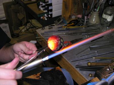 A thin clear rod is used to twirl between the dots and produce the pinwheels
