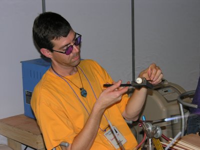 Bandhu made a glass rack for 3 of Brad's big beads, one of which he is making here.