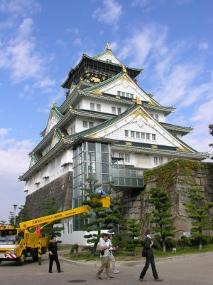 Full on shot of the castle, while the trees are being trimmed.