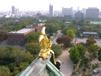 The golden fishhead with the city of Osaka beyond.