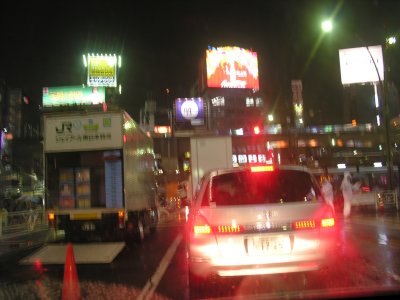 This is a famous view of Tokyo seen in many movies.  Well, not with a car's taillights like this...