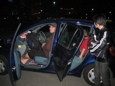 Aki worked to try and fit ALL 15 of us in these 2 cars, with luggage.They had Brendon on CherryBoys lap for a while (blk jacket)