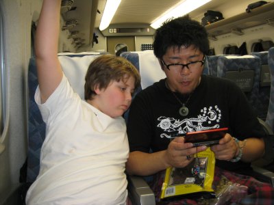 On the bullet train!  Guess what Brendon and Yoshio are playing...