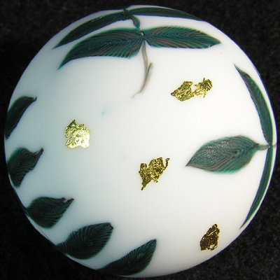Top view, gold leaves floating around
