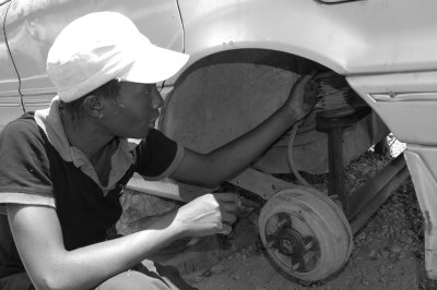 Anna working on the car