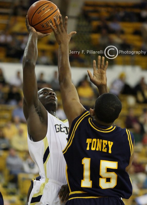 GT G Anthony Morrow goes up strong over UNCG G Kendall Toney