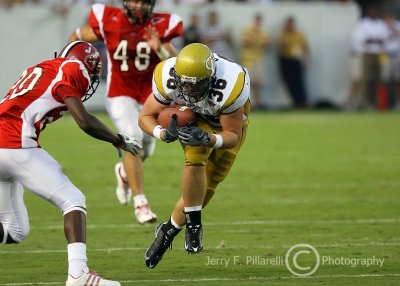 Yellow Jackets RB Lucas Cox prepares to take an open field hit from JSU CB A.J. Davis