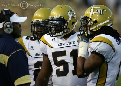 GT S Cooper Taylor, LB Brad Jefferson and S Morgan Burnett consult with LB Coach Brian Jean-Mary