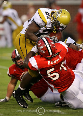 Jackets B-back Dwyer is stacked up by Jacksonville State LB Antonio Bonner
