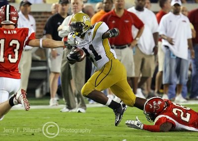 Jackets B-back Dwyer breaks the tackle of JSU SAF Keginald Harris