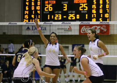 Yellow Jackets OH Kellogg celebrates a game point with her teammates