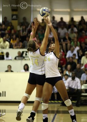 Yellow Jackets teammates S Allie Niekamp and OH Kellogg collide as they go for the ball