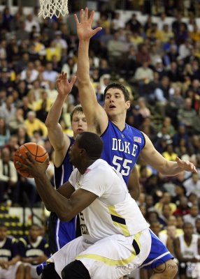 Yellow Jackets F Peacock looks to shoot around Blue Devils C Zoubek