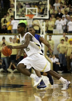 Yellow Jackets G Shumpert works to get by a Blue Devils defender near mid-court