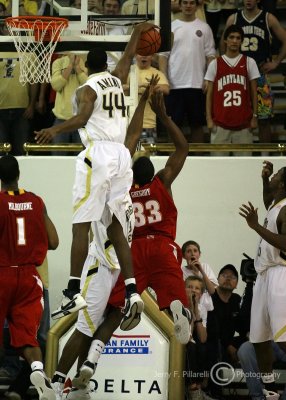 Yellow Jackets F Aminu blocks the layup attempt by Terrapins F Dino Gregory