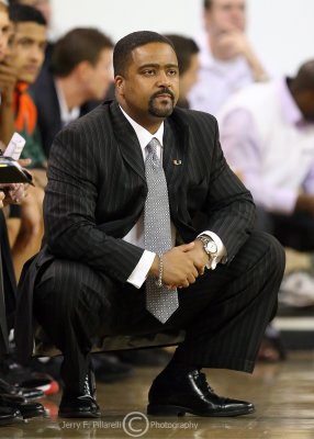 Miami Hurricanes Head Coach Frank Haith watches his team from in front of the Miami bench