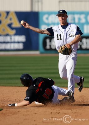 Yellow Jackets SS Evan Martin turns the double play